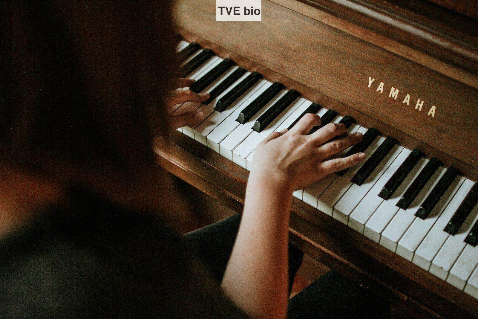 woman playing Yamaha piano